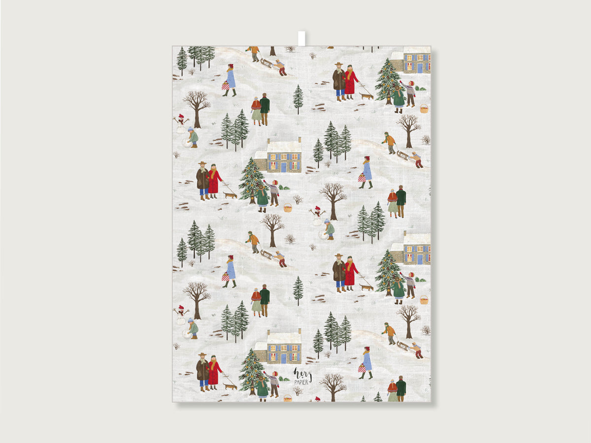 Ausgebreitetes Geschirrtuch aus Leinenmix mit Winterszenen wie Weihnachtsbaum, Schlittenfahren, und schneebedeckter Landschaft und Häuser. 